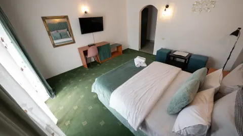Double bedroom and desk viewed from the balcony side
